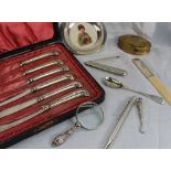 A set of six George V silver pistol handled knives together with a silver and pottery pin tray,