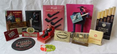 Assorted smoking related advertising wares including a seated figure in black tie smoking a cigar