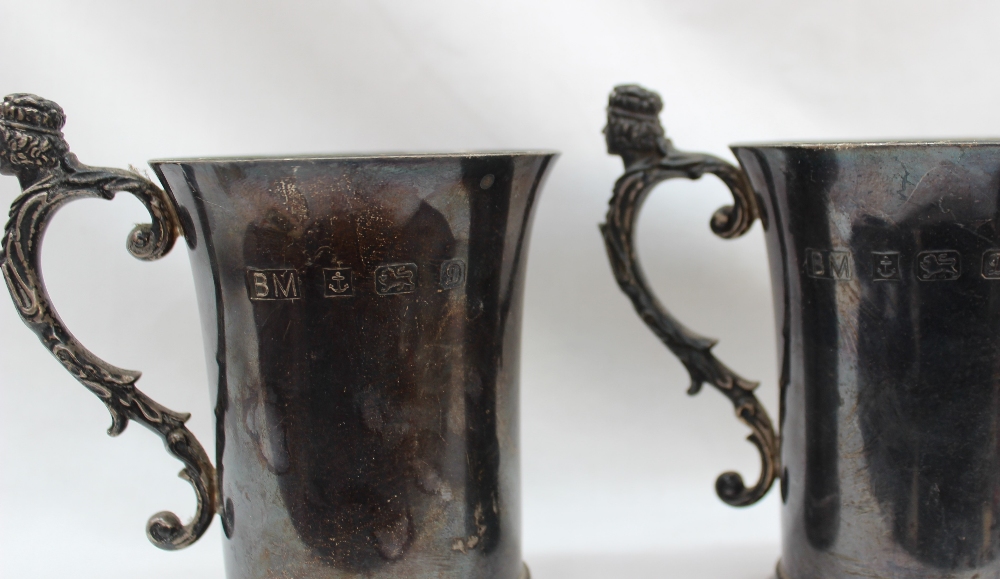 A pair of Elizabeth II silver tankards, the handle with a crowned head and leaves, - Image 2 of 3