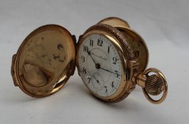 A Hampden Watch Co Railway grade 14k full hunter pocket watch, the case engraved with a stag,