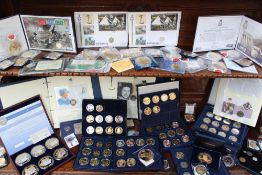 A large collection of white and yellow metal coins including Bailiwick of Guernsey 2006 five pounds,