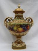 A Royal Worcester twin handled vase and cover, hand painted with apples, pears,