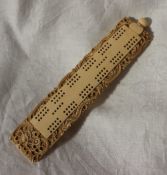 A late 19th / early 20th century Chinese ivory cribbage board carved with a dragon,
