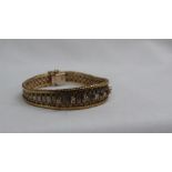 A two tone 9ct yellow and white gold and diamond bracelet,