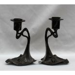 A pair of WMF desk candlesticks, decorated with a pine cone and leaves, marked WMF EP OX, 329, 13.