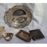 An Edward VII silver bon bon dish of circular form with a leaf and scroll cast and pierced rim,