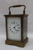 A brass cased carriage timepiece,