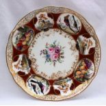 A Nantgarw porcelain plate from the Duke of Cambridge Service painted with a central bouquet of