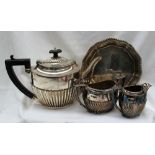 A George V silver matched three piece teaset of oval form with a half reeded body,