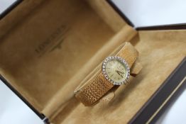 A Lady's 18ct yellow gold and diamond set Longines wristwatch,