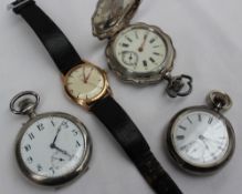 A white metal open faced keyless wound pocket watch,