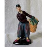 A Sitzendorf pottery figure of a fisherman in clogs, underglaze blue mark to the base,