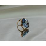 A topaz dress ring of pointed oval form to a 9ct yellow gold setting and shank