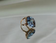 A topaz dress ring of pointed oval form to a 9ct yellow gold setting and shank