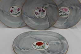 A Set of four Chamberlain Worcester plates the gilt rim to a marbled body,