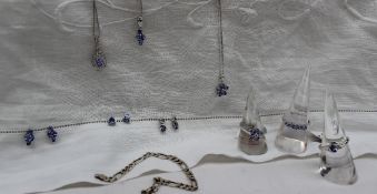 A quantity of tanzanite jewellery including a floral shaped ring, to a 9ct white gold shank,