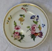 A Swansea dessert plate, painted with scattered flowers to the centre and a gilded border,