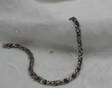 A 9ct gold diamond bracelet,
