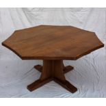 A Robert Thompson of Kilburn "Mouseman" octagonal topped dining table with an adzed top and concave
