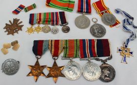 A set of four World War II medals including The 1939-1945 star, The Africa Star,
