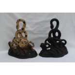 A Victorian cast iron doorstop in the form of a coiled serpent,