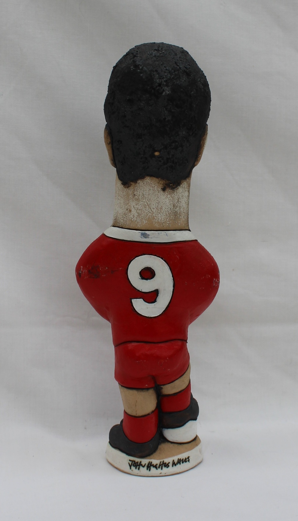 A John Hughes pottery Grogg of Ian Rush, with arms folded and foot raised on a football, - Image 3 of 5