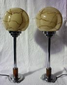 A pair of Art Deco style table lamps, with circular marbled glass shades,