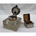 An early 20th century silver topped and glass inkwell,