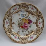 A Nantgarw porcelain plate, with a raised gilt decorated border,