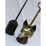 A Victorian brass doorstop in the form of a fox head and riding whip,