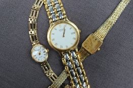 A Lady's 9ct yellow gold Rotary Elite wristwatch with a white oval face and batons on a 9ct yellow