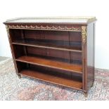 A Regency style mahogany bookcase the rectangular top with a gilt three quarter gallery above a