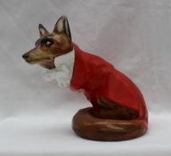 A Royal Doulton Fox seated in hunting dress wearing a white bow tie with gold stock pin, HN100,