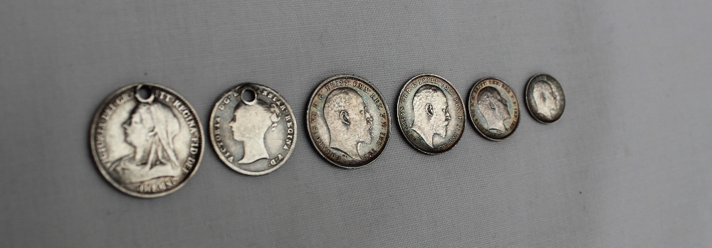 An Edwardian VII 1902 Maundy set together with a Victorian six pence dated 1893 and a four pence