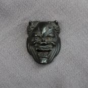 A Japanese bronze Oni Noh mask depicting a horned devil, with a bar on the reverse, 4.