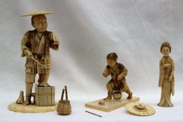 A 19th century Japanese ivory figure depicting a figure of a man with a turtle on a coopered barrel,