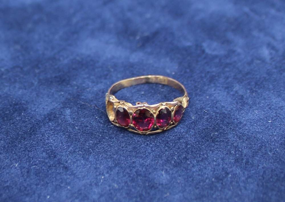 A 15ct yellow gold amethyst set line ring,