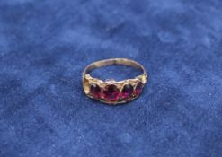 A 15ct yellow gold amethyst set line ring,