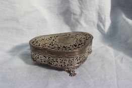 A George V silver jewellery box, of lobed shape with a pierced lid and sides decorated with birds,