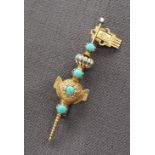 A Victorian yellow metal turquoise set bar brooch in the form of a stylised key,