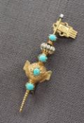 A Victorian yellow metal turquoise set bar brooch in the form of a stylised key,