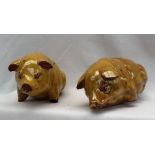 Two Ewenny Pottery pigs, with a mustard yellow glaze, inscribed "Y Mochyn', one marked E.