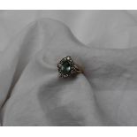An aquamarine and diamond ring, the central oval aquamarine approximately 8mm x 6mm,