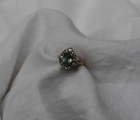 An aquamarine and diamond ring, the central oval aquamarine approximately 8mm x 6mm,