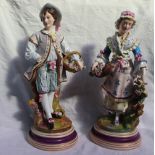 A pair of 19th century continental porcelain figures,