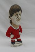 A John Hughes pottery Grogg of Kenny Dalglish, in a red Jersey for Liverpool,