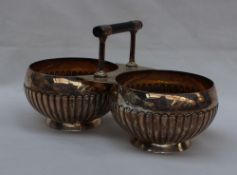 A Victorian silver twin sugar basin with a T bar handle,