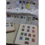 Two stamp albums containing world stamps,