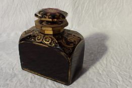 A ruby glass scent bottle of large size, the shoulders decorated with gilt scrolls,