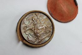 A Greece 1906 Olympic Games gilt bronze medal depicting Victory offering a laurel wreath as a